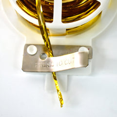Hand cutting twist tie from dispenser roll