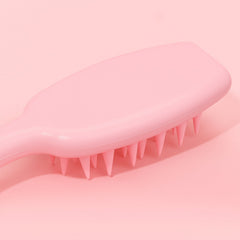 Scalp scrubber shampoo brush showing bristles