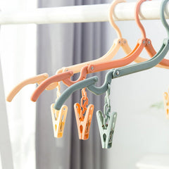 Foldable clothes hanger extended