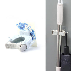 Mop holder clip installed on wall holding mop handle