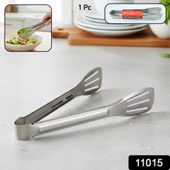 Steel Kitchen Serving Tongs on wooden table
