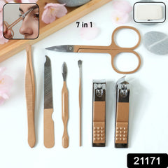 Set of nail care tools including cutters, scissors and file