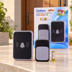 A wireless doorbell set, including a transmitter, receiver, and battery, sits on a stone surface with its packaging behind