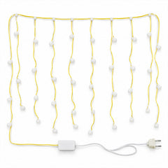 The warm white bulb string lights are neatly arranged on a white surface, showing the control box and a two-pin plug.