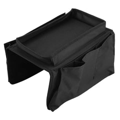 Sofa armrest storage bag holding books and iPad