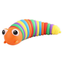 Child's hand interacting with a rainbow plastic slug fidget toy