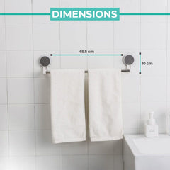 Self-adhesive towel rod installed in kitchen for drying cloths