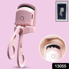 Close-up of Electric Heated Eyelash Curler in hand