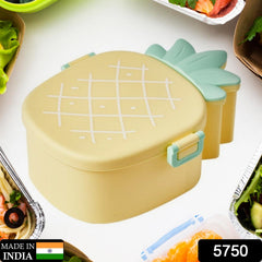 Close-up of pineapple lunch box lid with fork and spoon