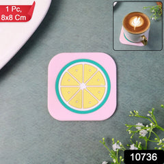 Ceramic cup on a vibrant lemon-patterned silicone coaster