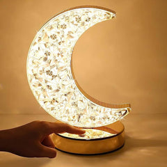 Moon desk lamp glowing with warm light