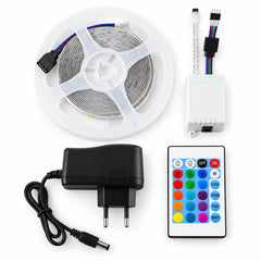 A coiled RGB LED strip light, white controller, power adapter, and remote control on a plain white background.