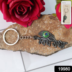 Close-up of Radha Krishna Radhe Radhe metal keychain