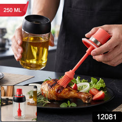 A person holds a glass oil dispenser with a red silicone brush over a grilled chicken leg, with 250 ML label.