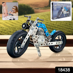 Child assembling metal bike toy with tools