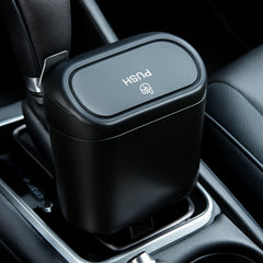 Compact plastic mini car trash can featuring lid