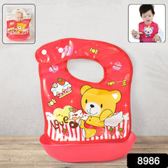 Baby bib showing broad coverage and velcro closure