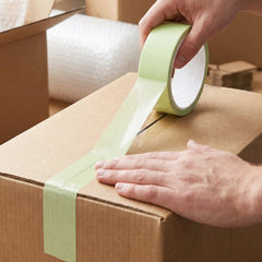 Adhesive tape roll sealing boxes in lifestyle scene