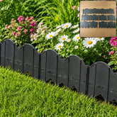Plastic garden lawn edging border installed around flower bed