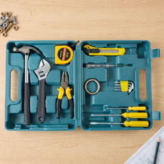 An open teal plastic toolbox contains a hammer, adjustable wrench, pliers, tape measure, utility knife, and various