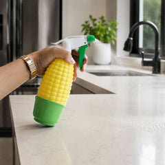 Decorative corn shape sprayer used for watering indoor plants.