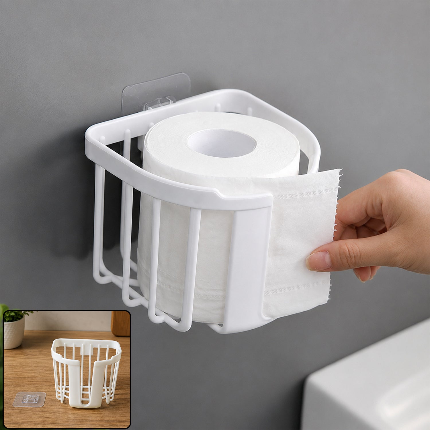 Self adhesive plastic toilet paper holder in bathroom