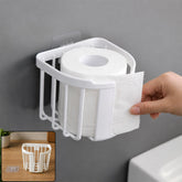 Self adhesive plastic toilet paper holder in bathroom