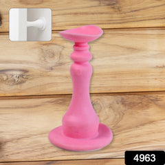 Door stopper holding a washing machine door ajar