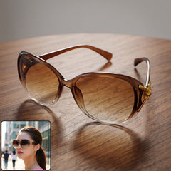 Woman wearing stylish oversized sunglasses, showcasing their fashionable appeal.
