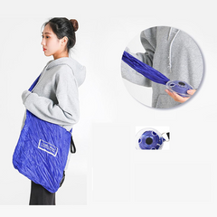Foldable reusable insulated grocery shopping bag in black folded