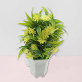 Artificial yellow flower plant in white pot