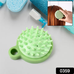 Scalp massage comb held in hand demonstrating size