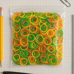 Assorted multicolor rubber bands in a pile