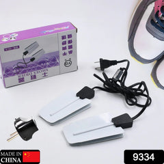 Electric shoe dryer device shown from an angle.