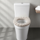 Soft toilet seat cover cushion installed on a white toilet