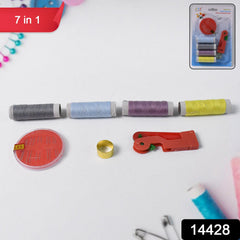 Assorted thread bobbins and sewing tools inside kit