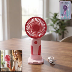 Mini handheld rechargeable fan in use