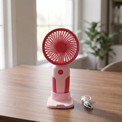 Mini handheld rechargeable fan on white background