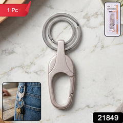 Close-up of the metal keychain's spring-loaded carabiner clip mechanism
