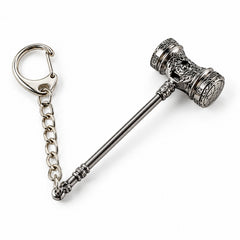 The silver-plated hammer keychain with a detailed design and a secure clip, presented against a clean white background.