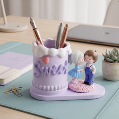 Sweet couple pen holder on white background