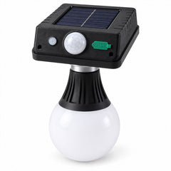 A black solar panel light with a white globe bulb, featuring a motion sensor and green power button.