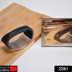 Close-up view of stainless steel garlic press