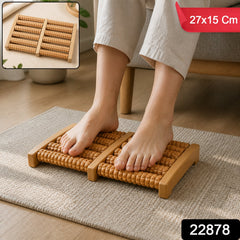 A person's bare feet on a wooden foot massager, with a red banner showing '27x15 Cm' and a black box with '22878'.