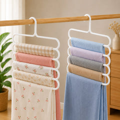 Hanger holding five pairs of trousers