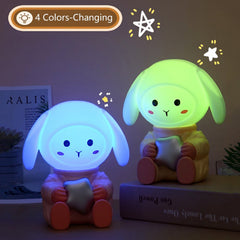Rabbit night light glowing on a bedside table