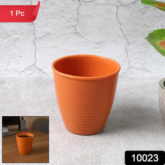 Durable plastic small drinking glass on white background