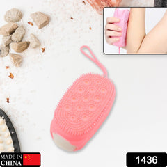 Close-up of silicone bath brush showing soft texture and dual-sided design.