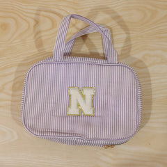 Detailed view of multi-pocket toiletry pouch