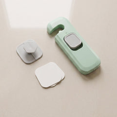 Adhesive child safety lock with mounting bases